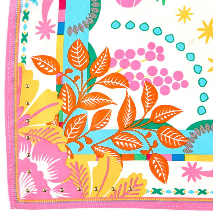 Close-up of the scarf's orange leaf and pink border print