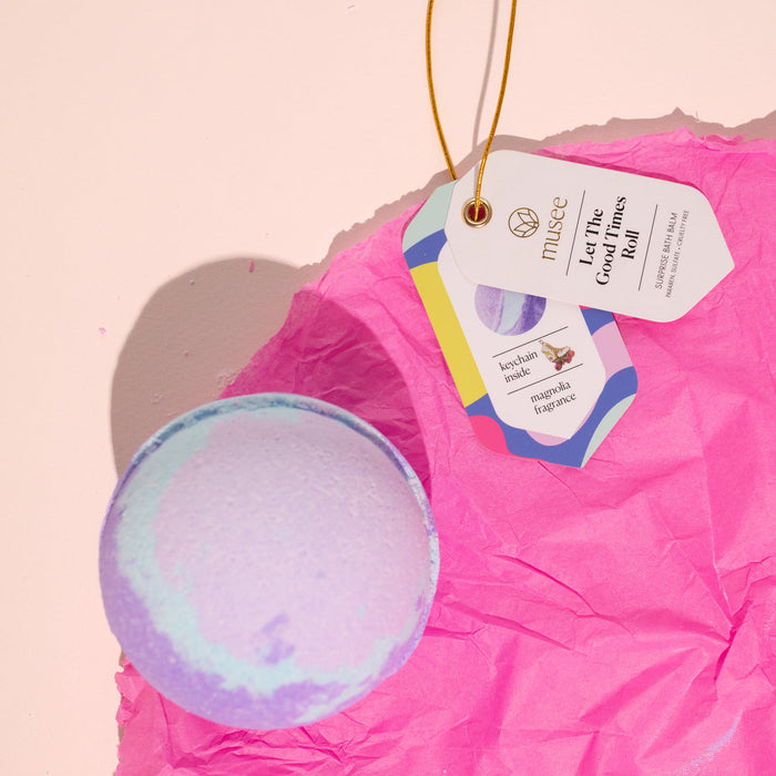 Pastel bath balm with gift tags on pink tissue paper