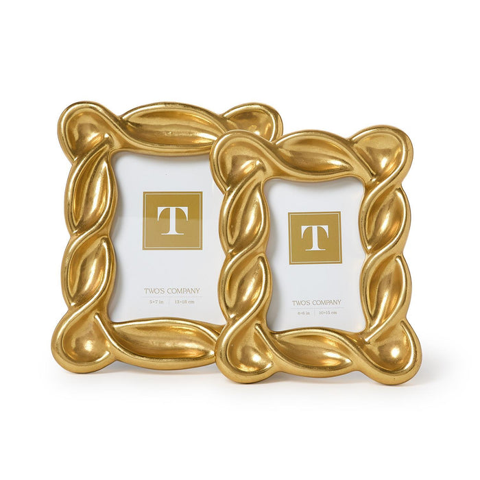 Two gold twisted picture frames