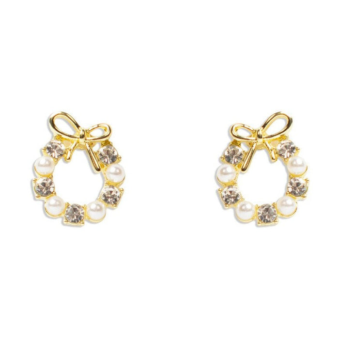 Gold bow stud earrings with alternating pearls and clear crystals in a wreath shape