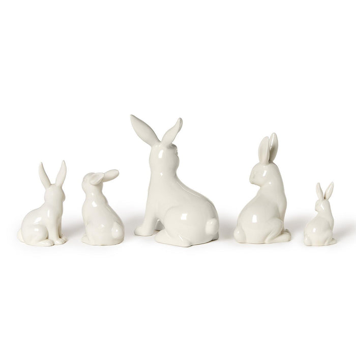 White porcelain bunny figures, side view
