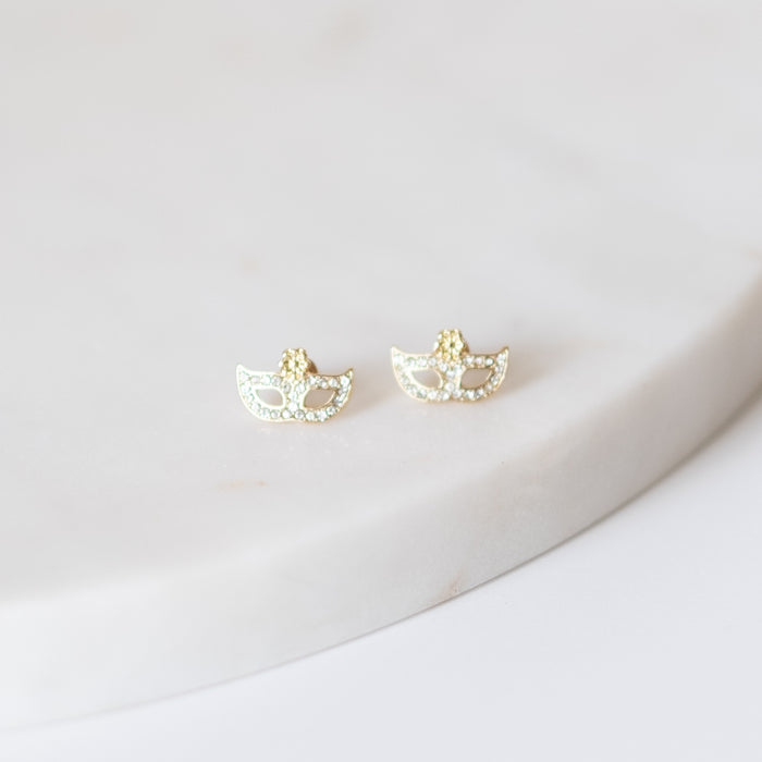 Gold masquerade mask stud earrings with small clear stones