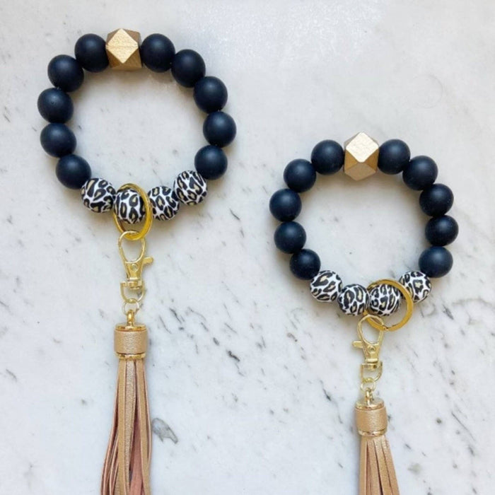 Black and cheetah print beaded wristlet keychains with gold tassels