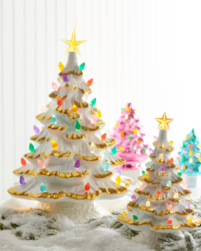 White and gold lighted ceramic tree styled with pink and teal trees