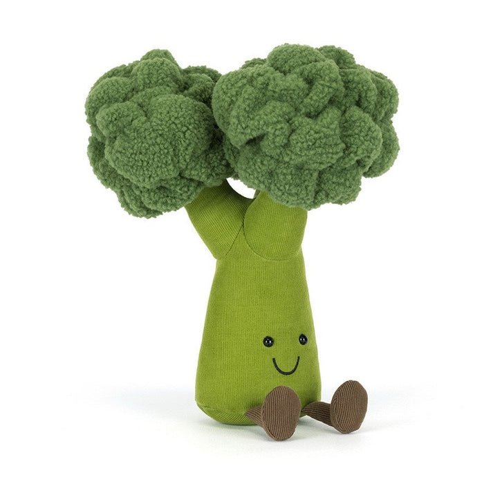 Plush broccoli toy with a smiling face and brown feet