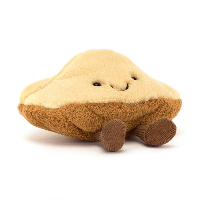 Plush toy shaped like a piece of toast with a smiling face and corduroy legs