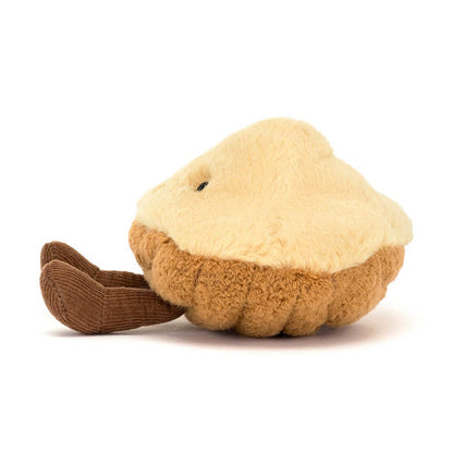 Plush toy shaped like a pie with a tan crust and cream colored top with small brown corduroy legs