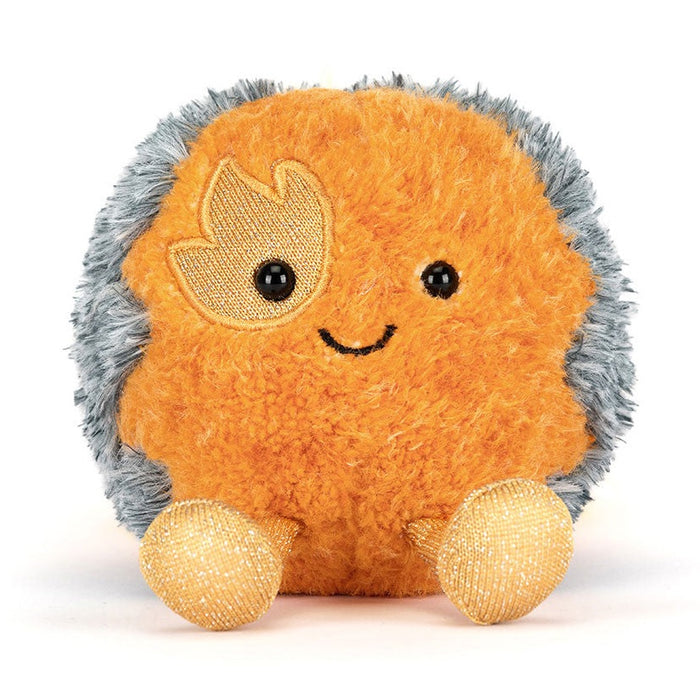 Front of a fuzzy orange comet plush with a smiling face