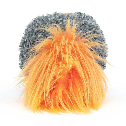 Back of a comet plush showing its orange and gray fur