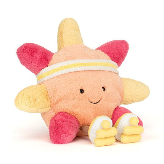 Plush star toy wearing a headband and sneakers