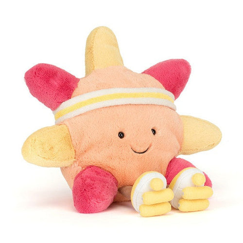 Plush star toy wearing a headband and sneakers