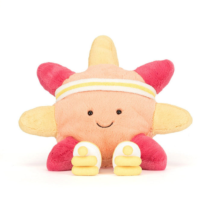 Plush star toy wearing a yellow and white headband and white sneakers