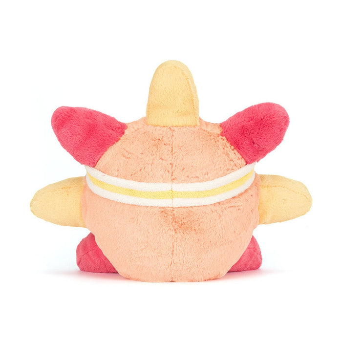 Back view of a peach and pink plush toy with yellow accents and a headband
