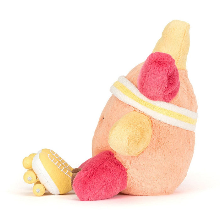 Plush toy shaped like a peach wearing a headband and yellow roller skates