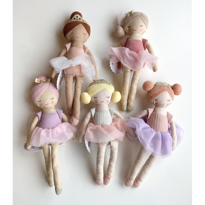 Five plush ballerina dolls with tulle skirts and hair accessories arranged on a white background