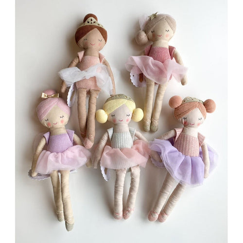 Five plush ballerina dolls with tulle skirts and hair accessories arranged on a white background