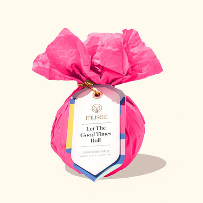 Musee Let the Good Times Roll bath balm wrapped in pink tissue