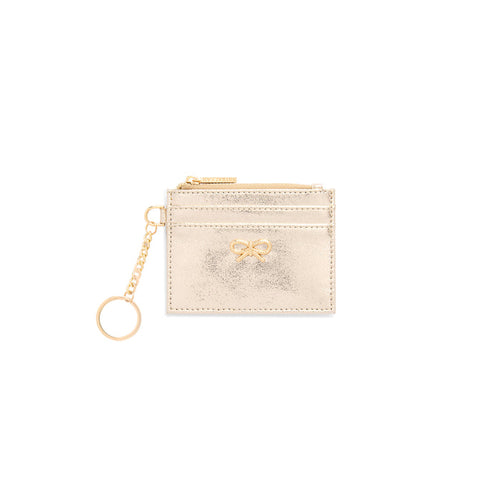 Cream card case with a gold bow and key ring