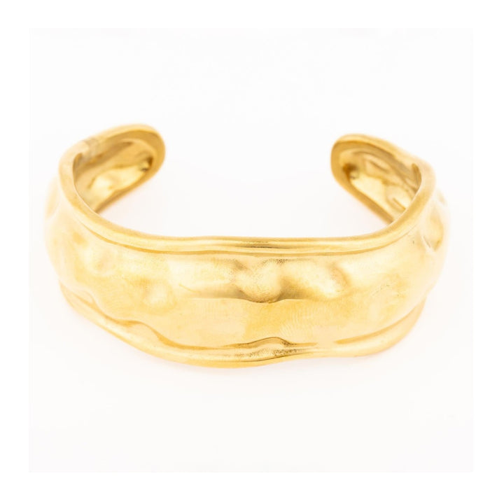 Gold cuff bracelet with a textured hammered finish