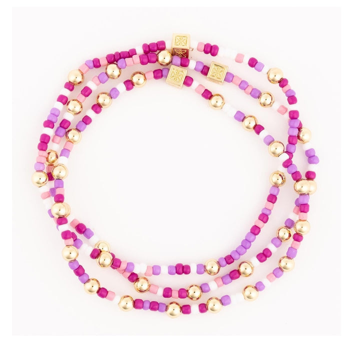 Set of purple, pink and gold seed bead stretch bracelets, third view