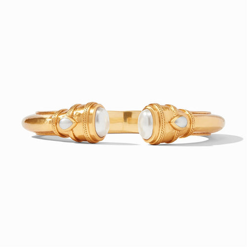 Gold cuff bracelet with pearl accents at both ends