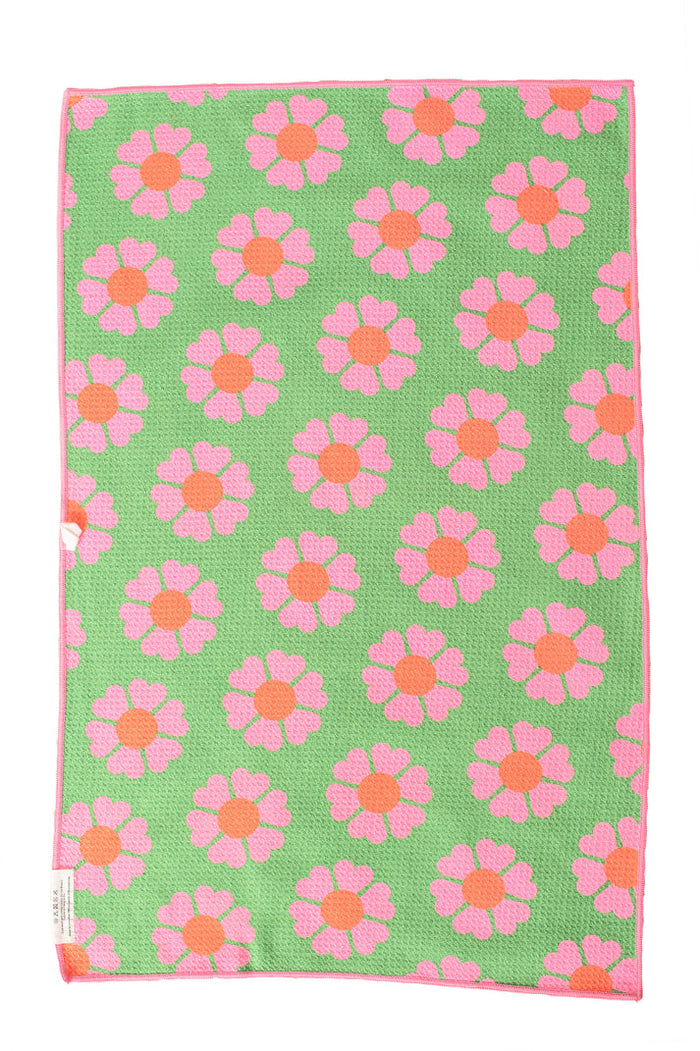 Green hand towel with a pink flower print