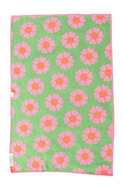 Green hand towel with a pink flower print