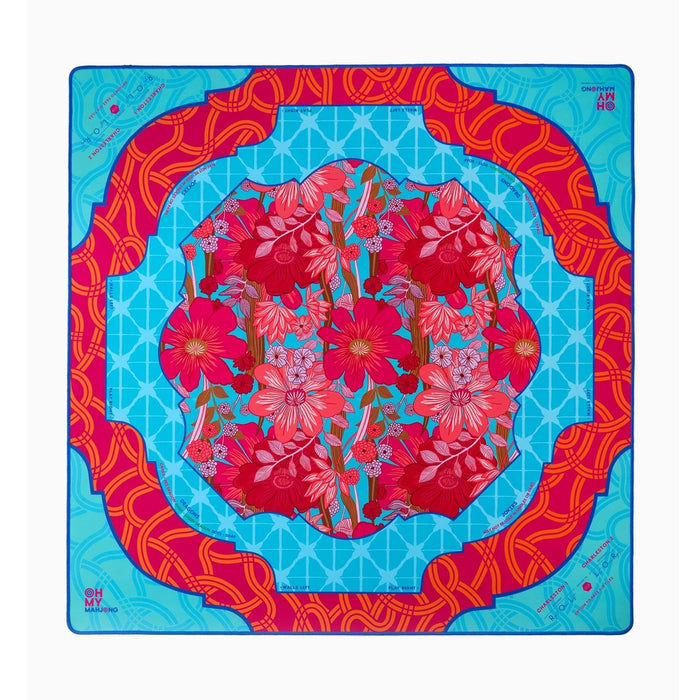 Delilah mahjong mat with a red floral center and turquoise and red borders