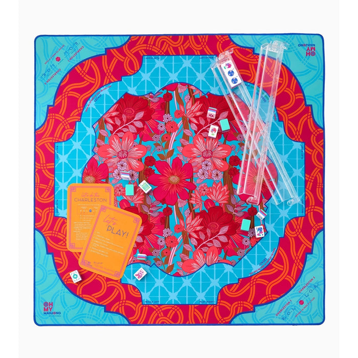 Delilah mahjong mat set up with clear racks, tiles and orange instruction cards