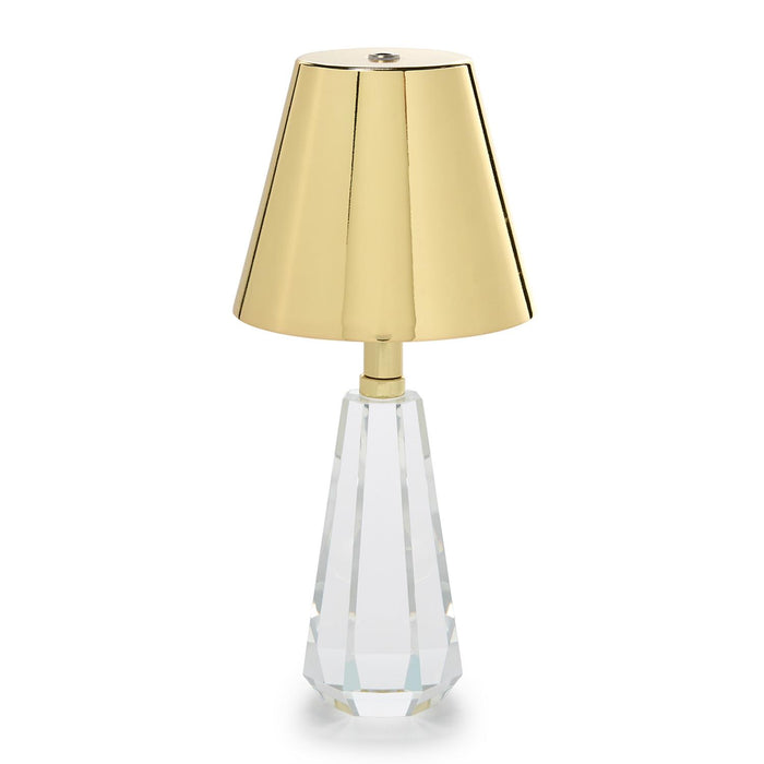 Cordless lamp with a faceted crystal glass base and gold shade
