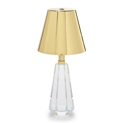 Cordless lamp with a faceted crystal glass base and gold shade