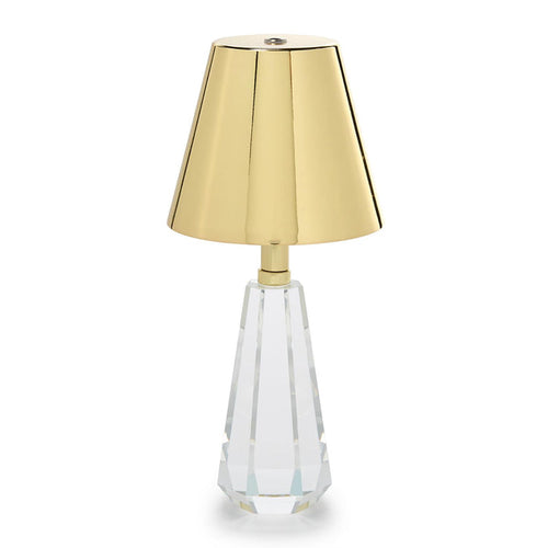 Cordless lamp with a faceted crystal glass base and gold shade