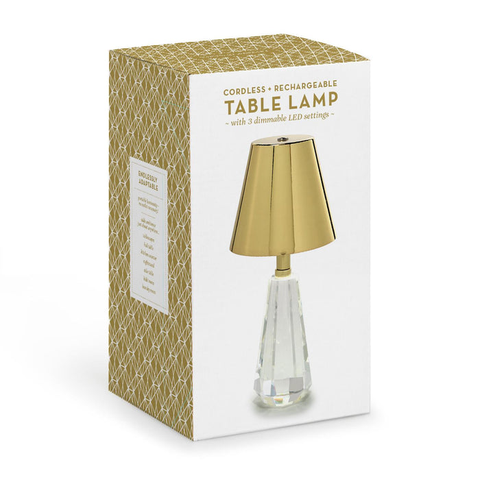 Cordless crystal table lamp beside its box