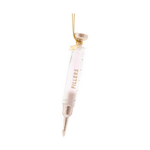 Glass syringe ornament filled with glitter and labeled Fillers