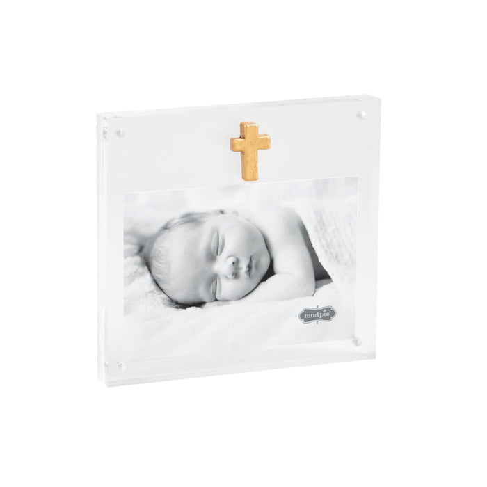Clear acrylic frame with a gold cross and baby photo, at an angle