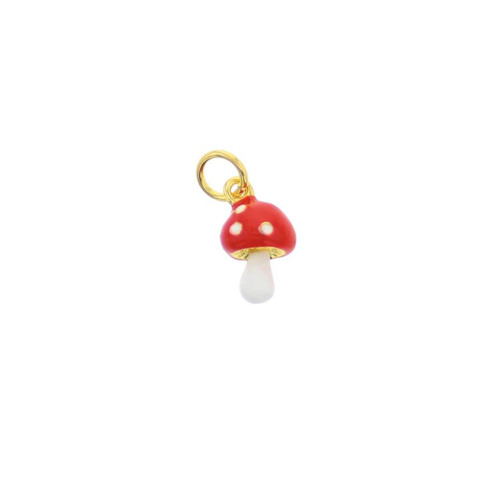 Gold charm with a red and white enamel mushroom