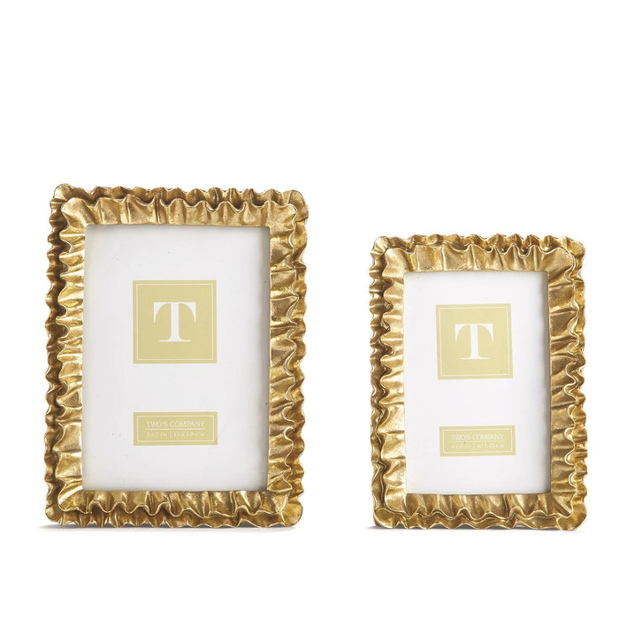 Two gold ruffle-edged picture frames