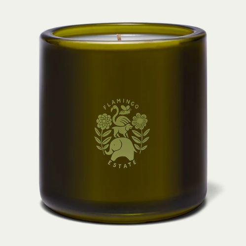 Back of the Flamingo Estate Green Goddess candle with an embossed floral crest