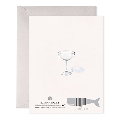 Back of a card with a champagne coupe illustration