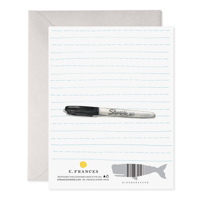 Back of a card with a black marker on lined paper