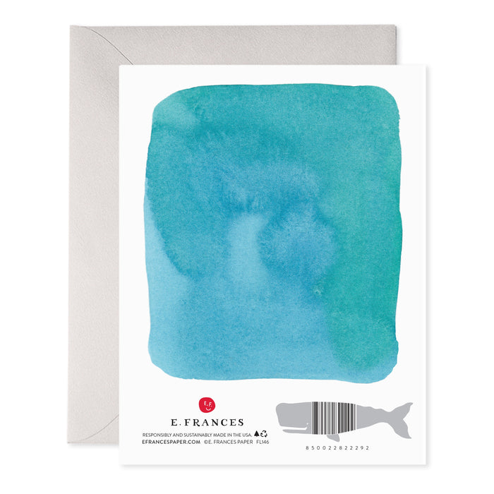 Back of a card with a teal watercolor wash