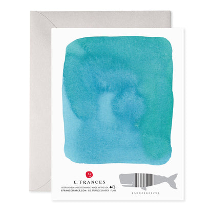 Back of a card with a teal watercolor wash