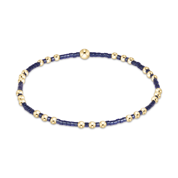 Gold beaded stretch bracelet with navy seed bead sections