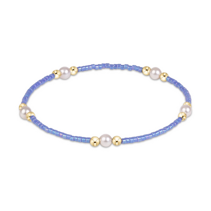 Periwinkle seed bead stretch bracelet with pearl and gold bead clusters