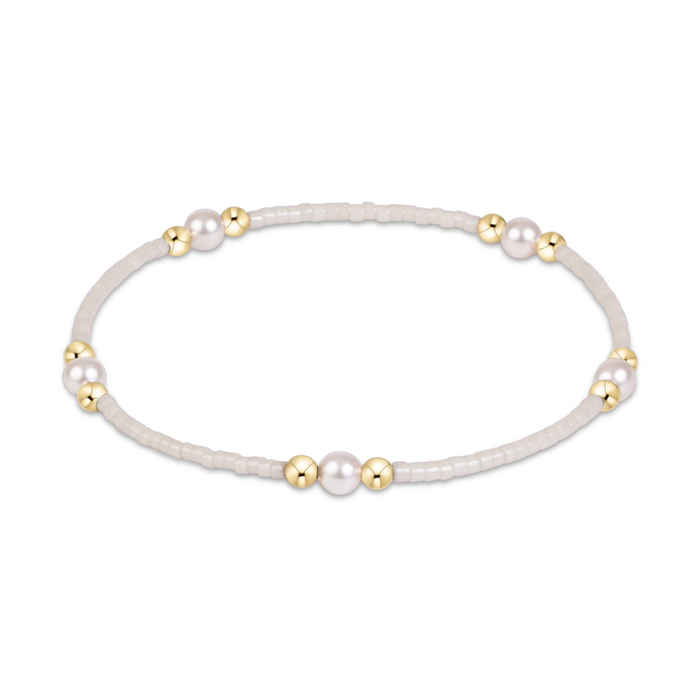 White seed bead stretch bracelet with pearl and gold bead clusters