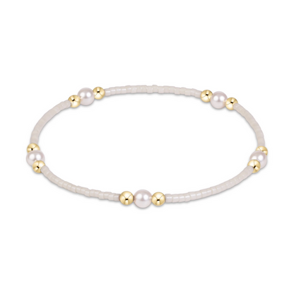 White seed bead stretch bracelet with pearl and gold bead clusters