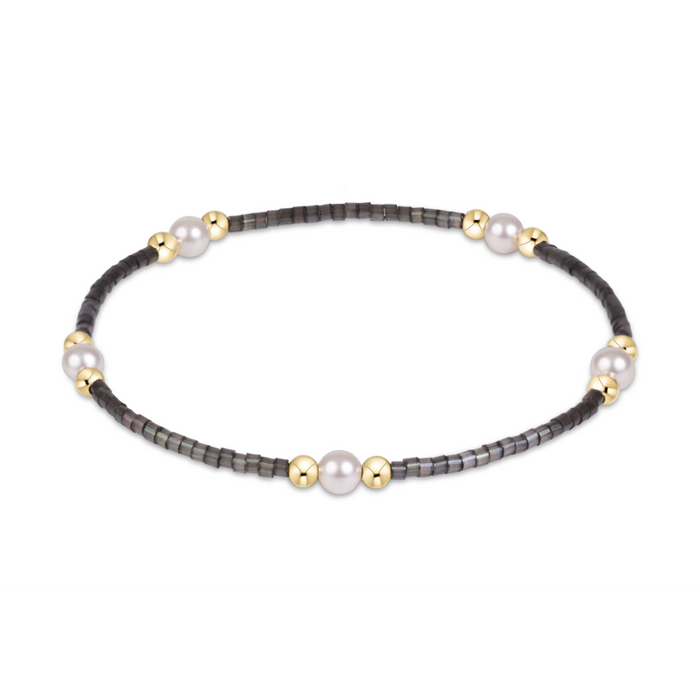 Black seed bead stretch bracelet with pearl and gold bead clusters