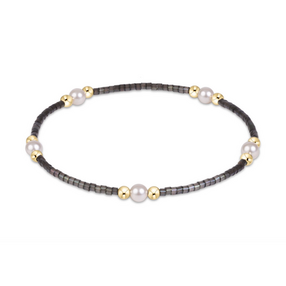 Black seed bead stretch bracelet with pearl and gold bead clusters