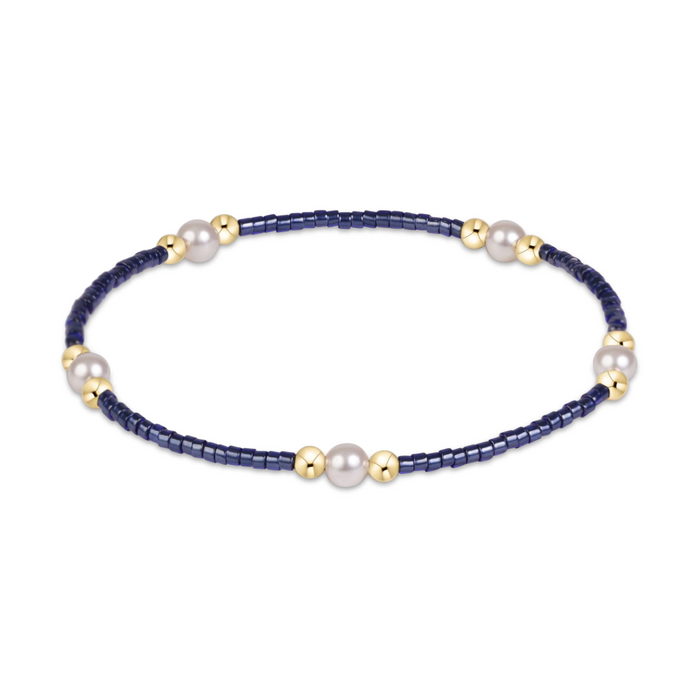 Navy seed bead stretch bracelet with pearl and gold bead clusters
