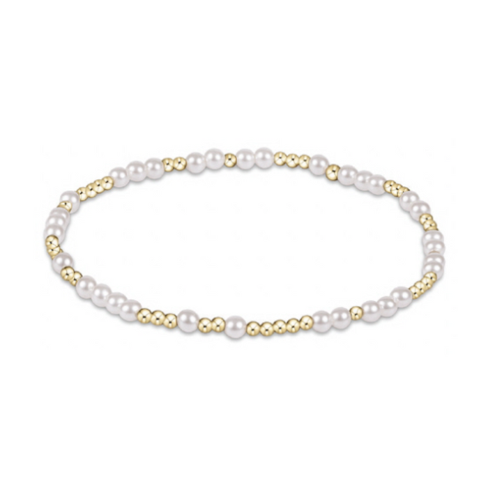 Thin gold beaded stretch bracelet with sections of small white pearls